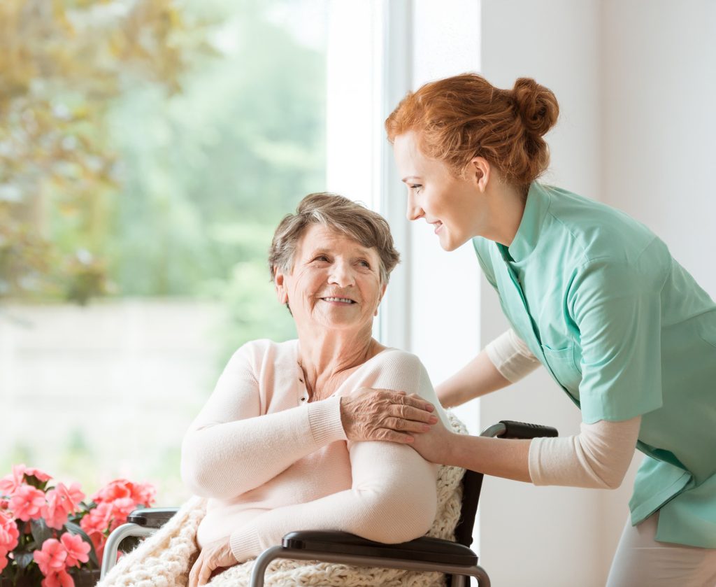 Caregiver smiling at a resident